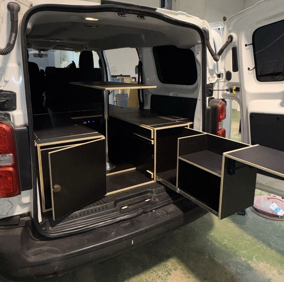 Peugeot Expert Camper Furniture Kit with multi-height indoor table configured for dining and lounge use